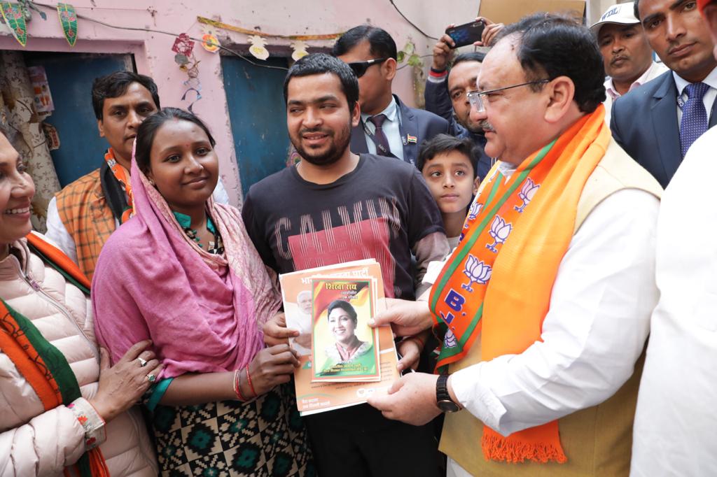 Photographs of BJP National President Shri J.P. Nadda door to door campaign under "Maha Jan SamparkAbhiyan" in Grater Kailash (New Delhi) .