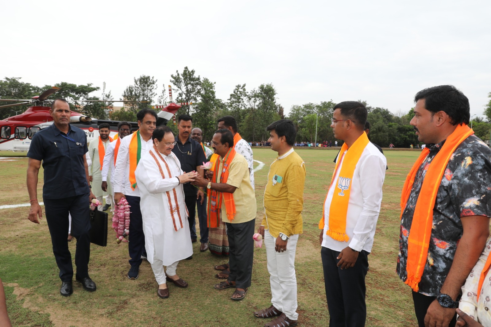 Grand welcome of BJP National President Shri J.P. Nadda on arrival at Jain College Helipad, Harohalli, Bengaluru (Karnataka)