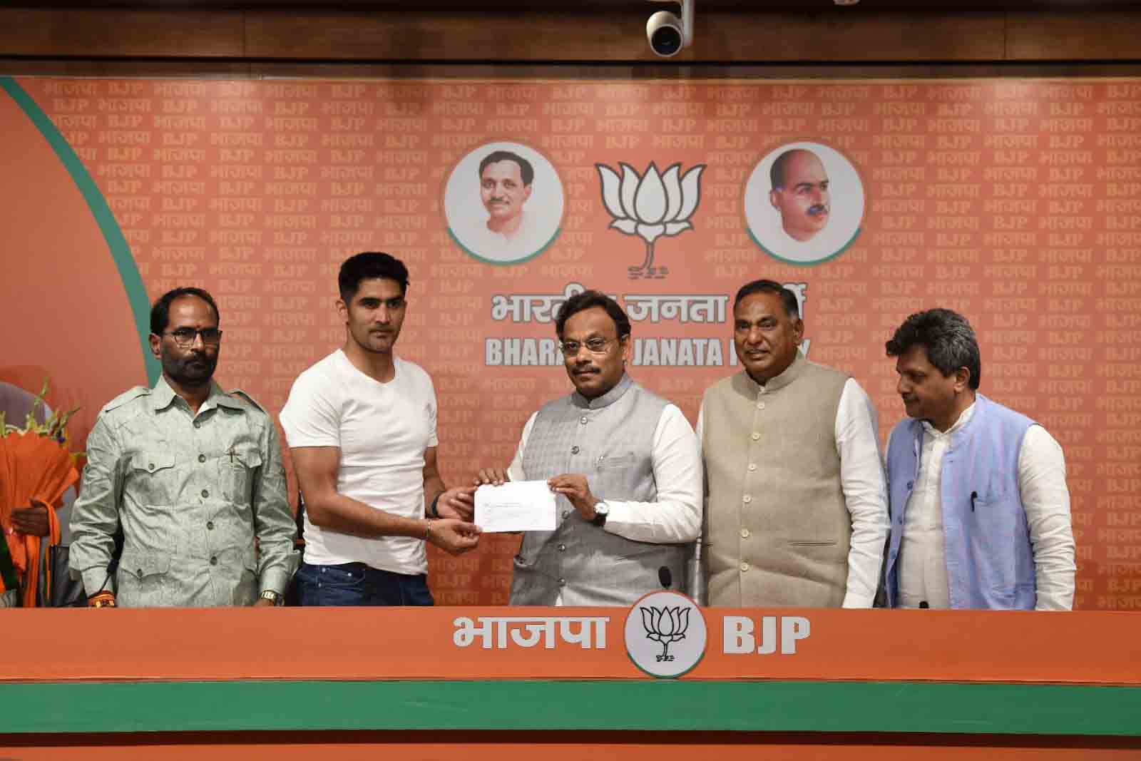  Boxer Shri Vijender Singh joins the BJP at party headquarters in New Delhi