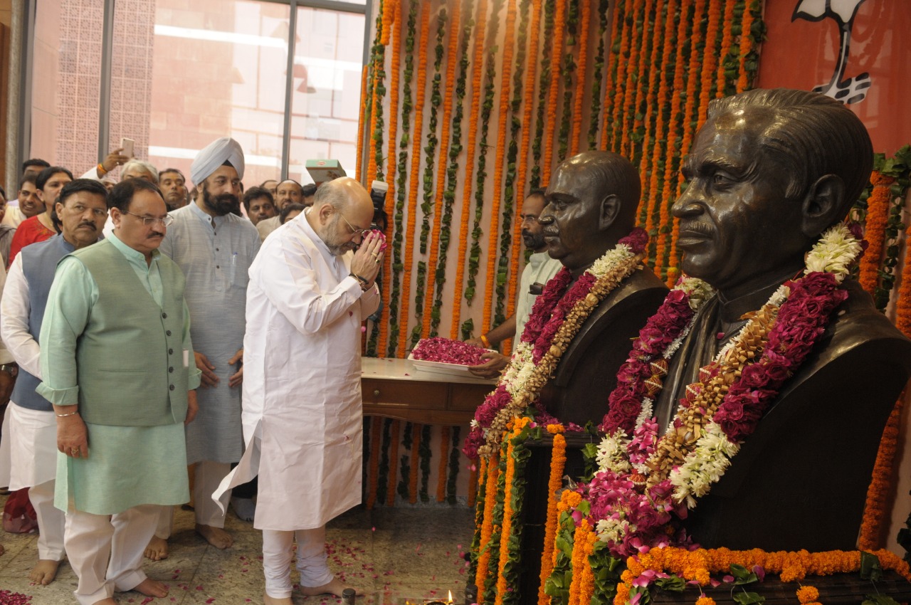 BJP National President and Hon'ble Home Minister Shri Amit Shah paying floral tribute to Pt. Deendayal Upadhyay ji on his Birth Anniversary at BJP HQ 6A Deendayal Upadhyay Marg, New Delhi