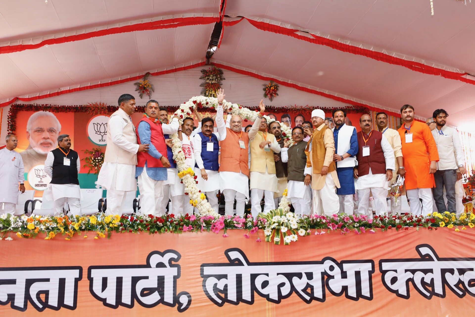 Photographs of BJP National President, Shri Amit Shah addressing Booth Karyakarta Sammelan at Bamora village, Sagar(Madhya Pradesh)