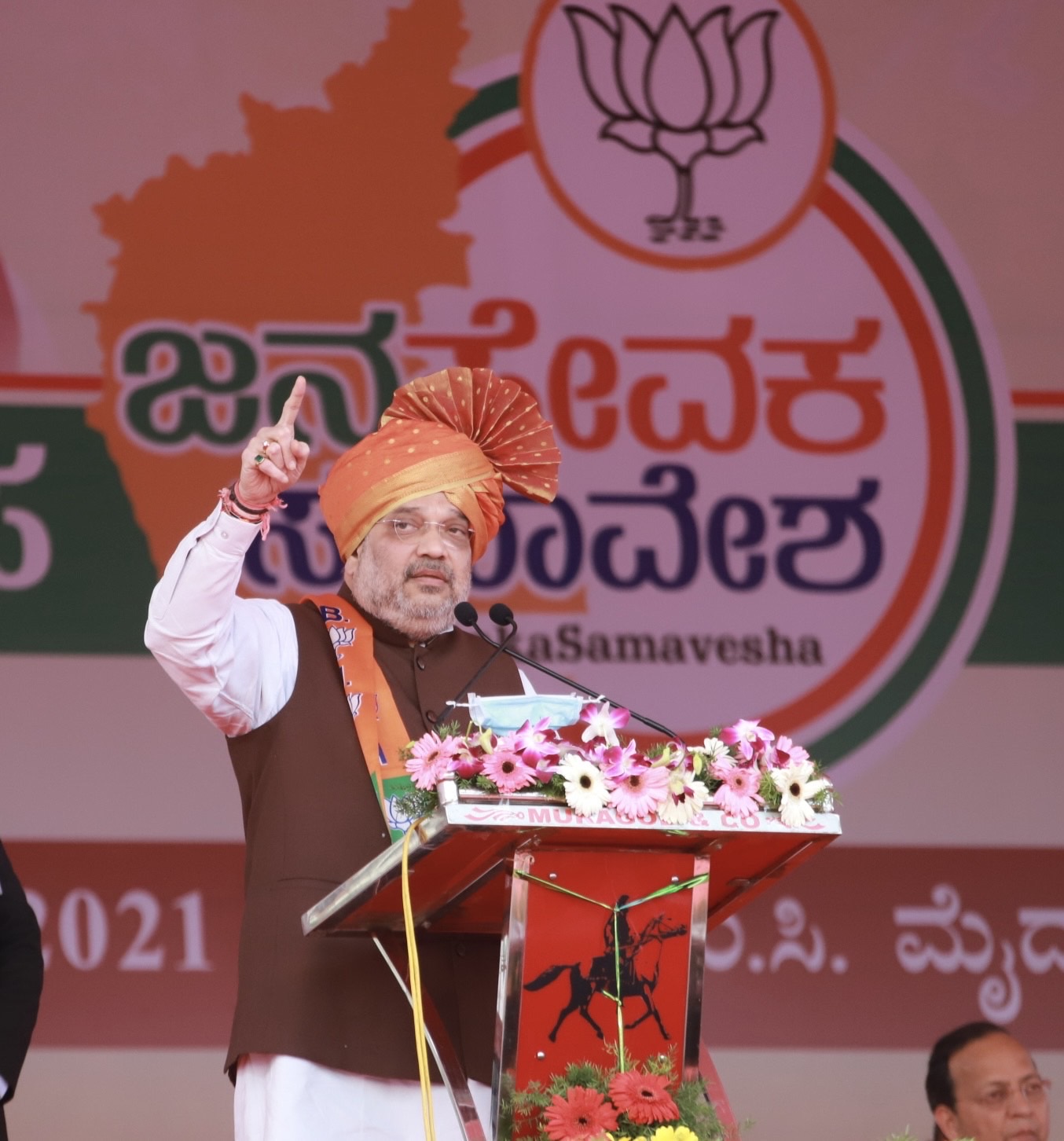 Photographs : Hon'ble Union Home Minister Shri Amit Shah addressing a public rally at JNMC ground, Belagavi (K'taka).