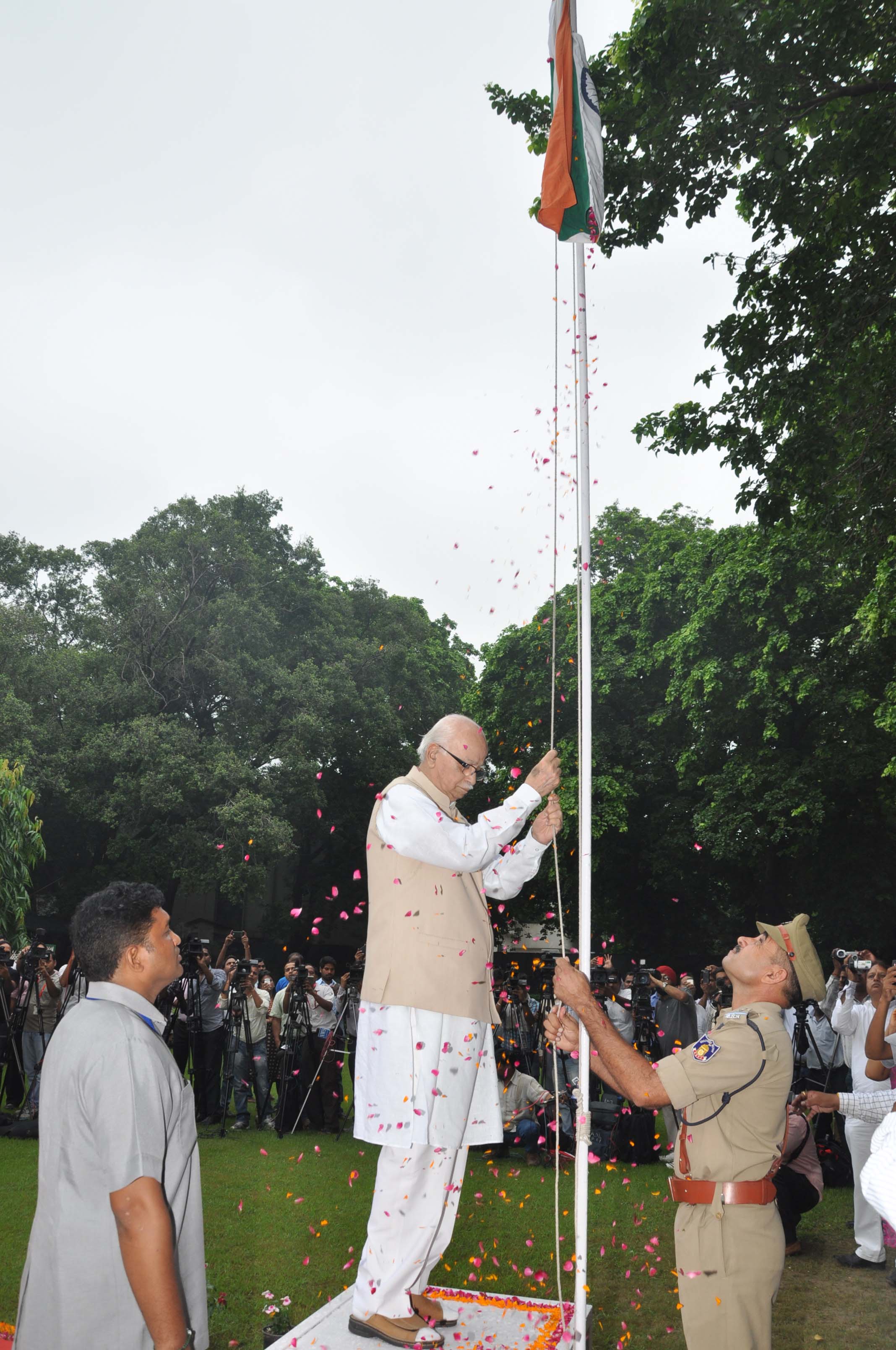 Shri L.K. Advaniji hoisting the National Flag at his residence 30, Prithviraj Road, New Delhi - 110001 on August 15, 2013