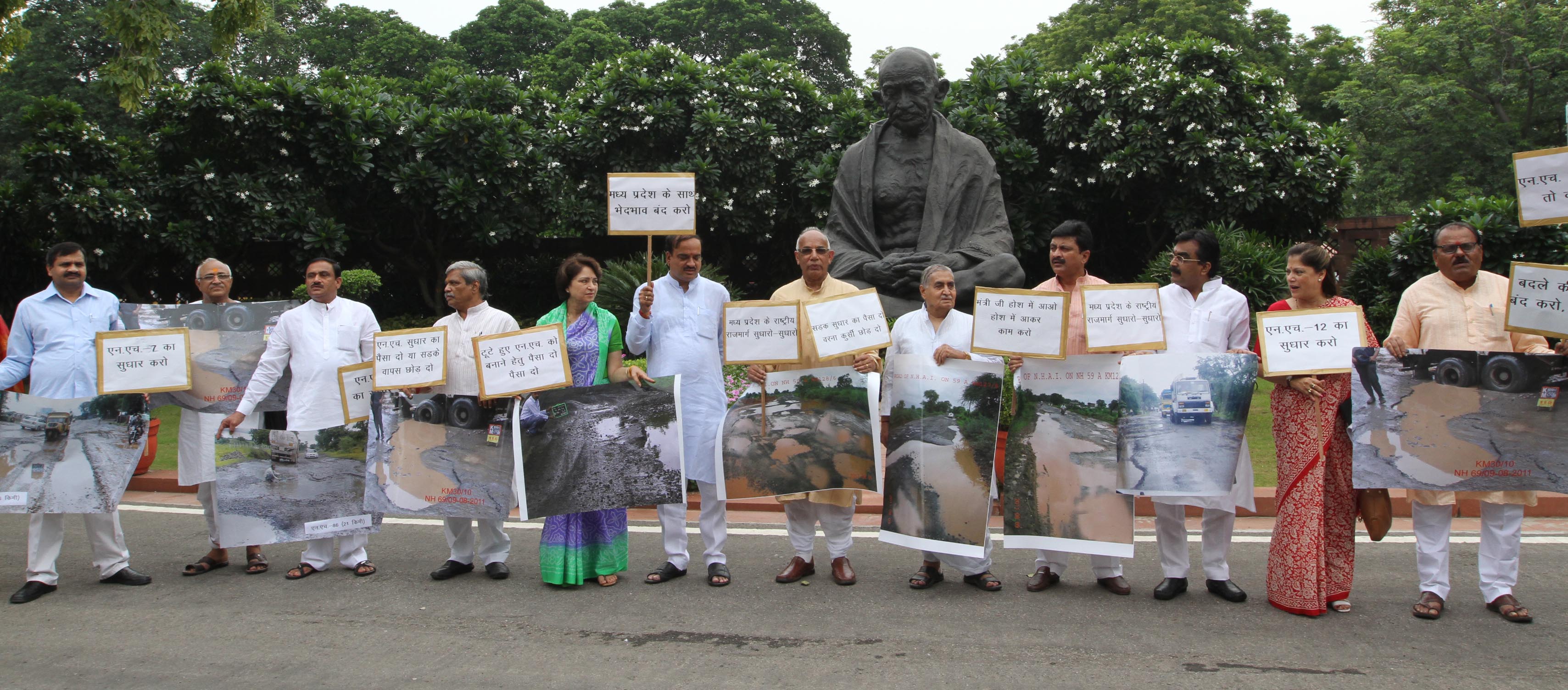 All BJP MPs from Madhya Pradesh protesting dharna against bad plight of National Highways in MP at Mahatama Gandhi statue, Parliament House on August 26, 2011