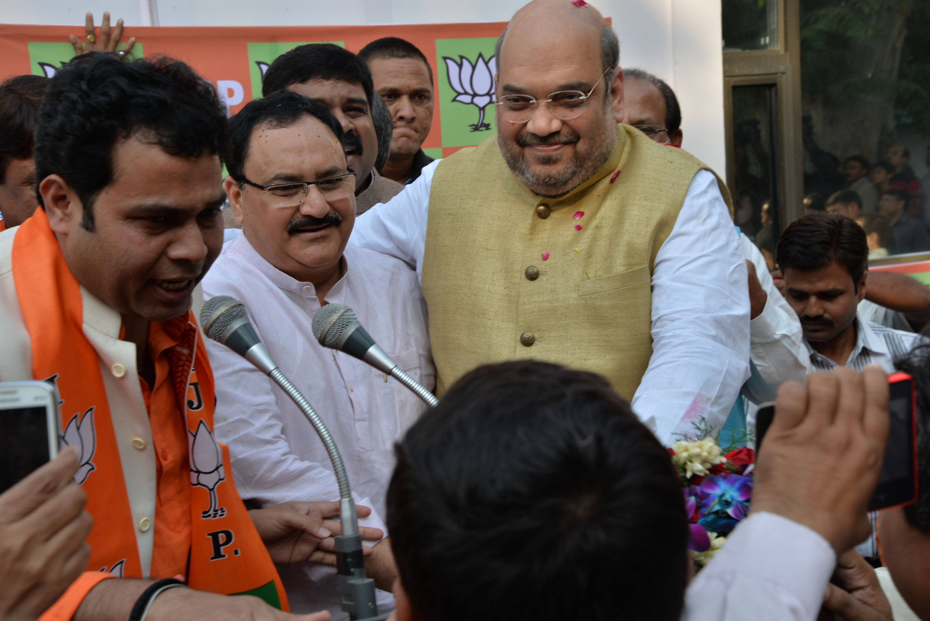 BJP National President, Shri Amit Shah being welcomed after BJP winning in Haryana & Maharashtra Assembly Elections at 11, Ashoka Road, New Delhi on October 19, 2014