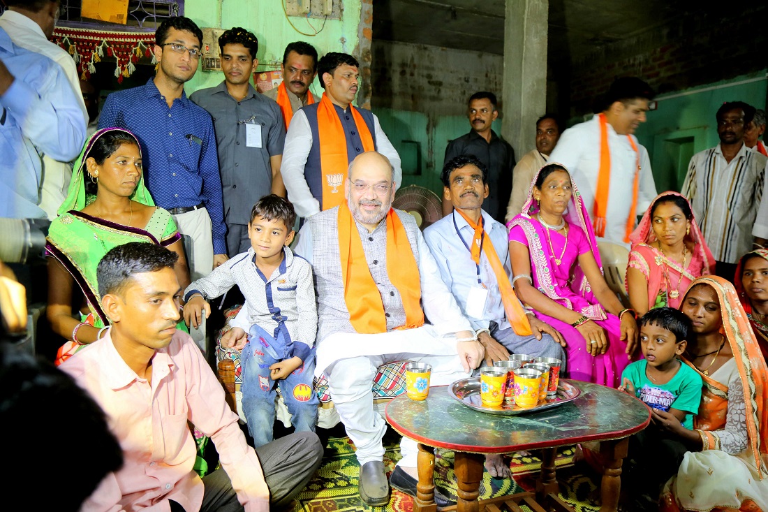 BJP National President Shri Amit Shah having lunch at Shri Popatbhai Ishwarbhai Rathwa Ji's residence at Devaliya village, Chhota Udaipur Gujarat on 31 May 2017