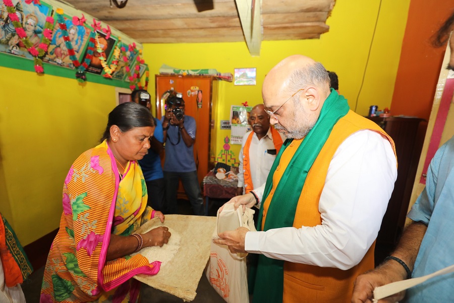 Photographs : BJP National President, Shri Amit Shah joined the statewide door to door campaign "Mushti Dhanya Sangrah Abhiyana" in Chinnenahalli Village, Srirangapatna, Mandya (Karnataka)