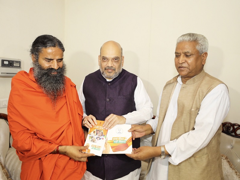 Photographs : BJP National President, Shri Amit Shah met Yog Guru Swami Ramdev for "Sampark For Samarthan" campaign in New Delhi