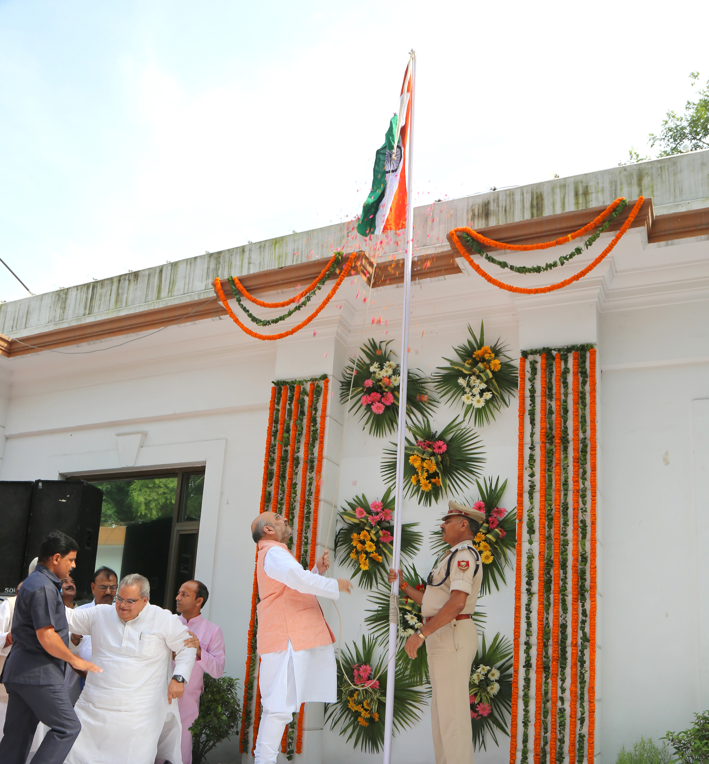 BJP National President, Shri Amit Shah unfurling the National Flag on the occasion of Independence Day at 11, Ashoka Road on August 15, 2016