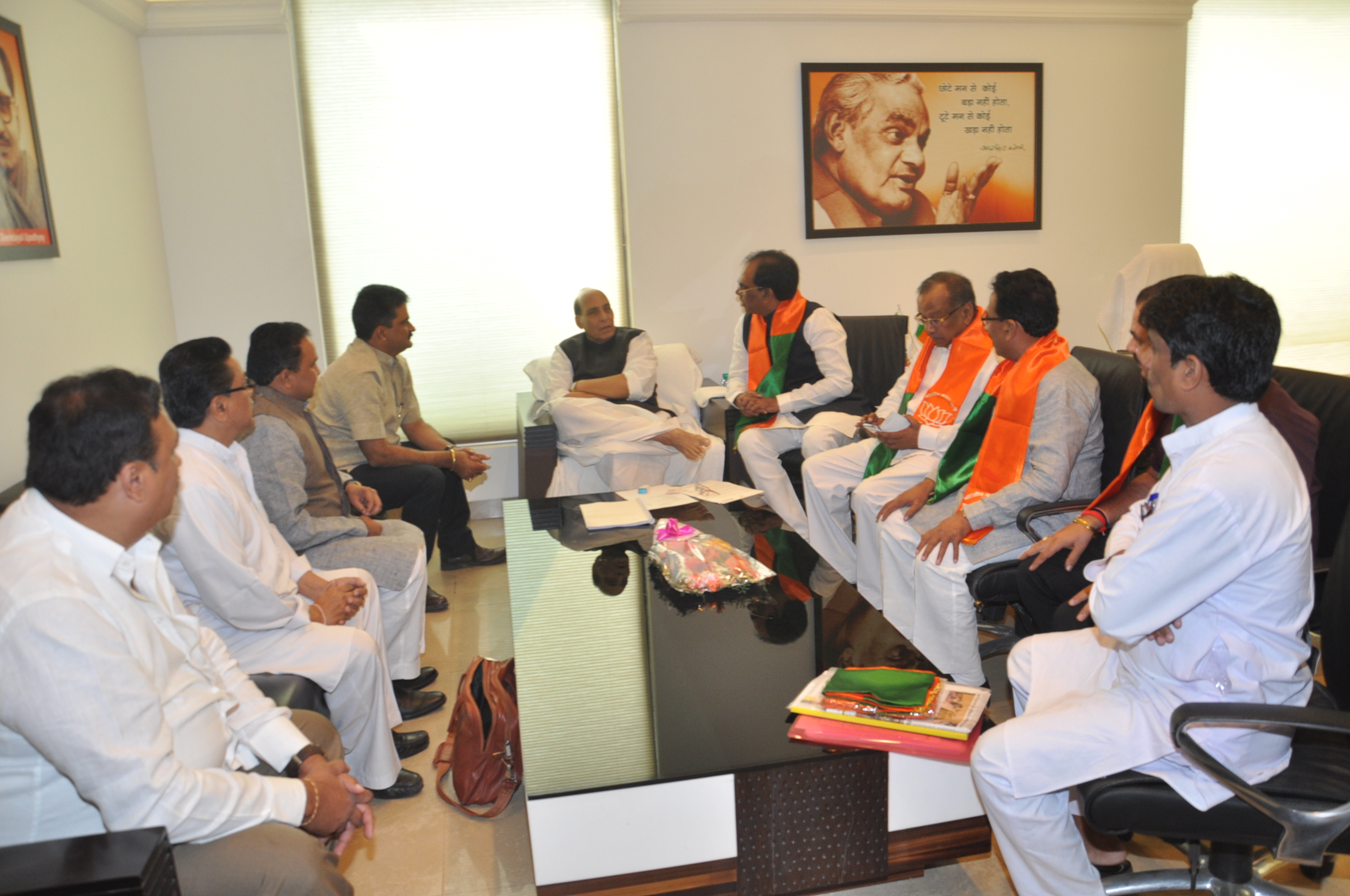 JD (U)'s Dadar Nagar Haveli Sate President Shri Fatehsinh Chauhan, Dr Chhatrasinh Chauhan, Shri Hirabhai L. Patel and Shri Rakeshsinh Chauhan joining BJP in the presence of BJP President, Shri Rajnath Singh on October 26, 2013