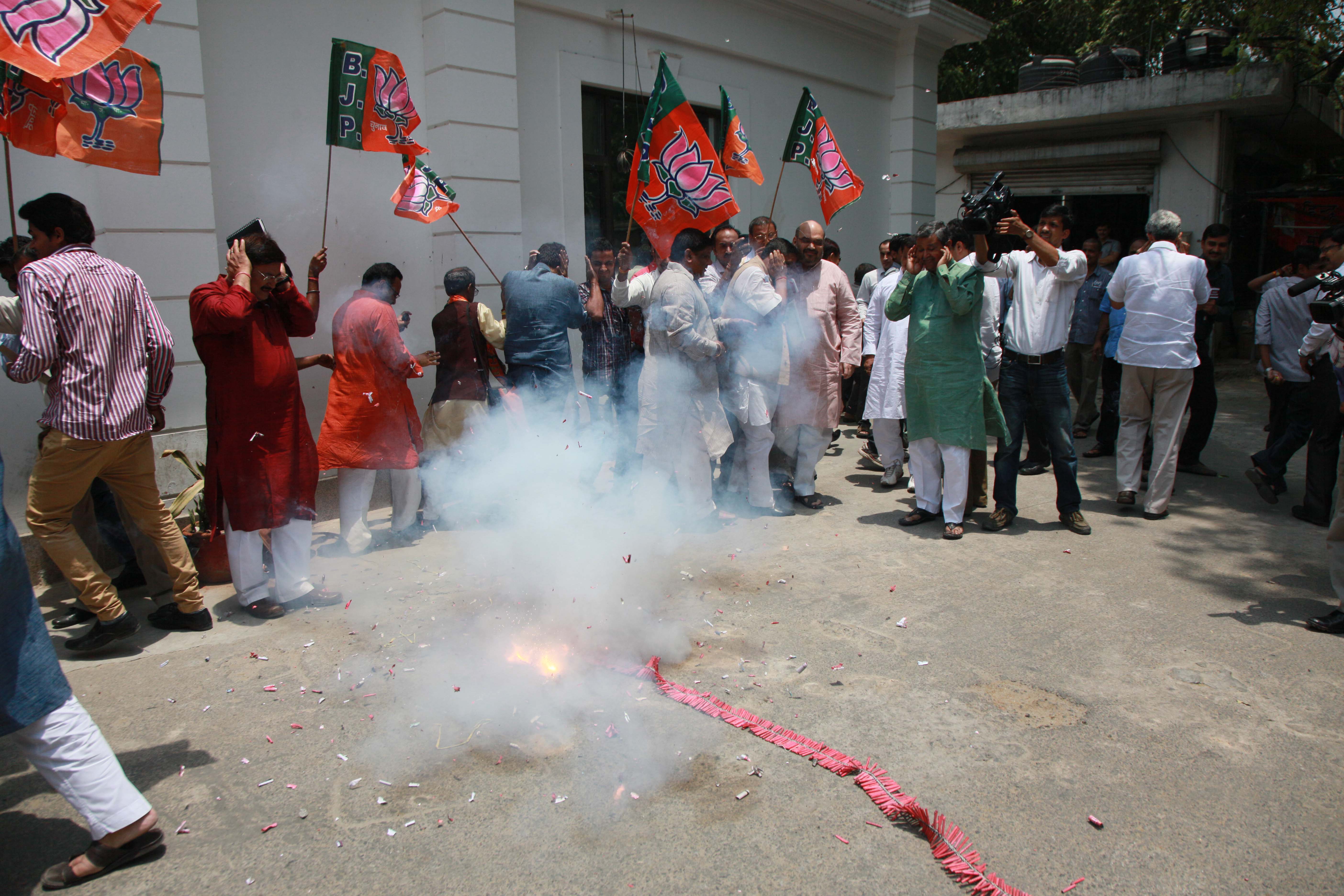 Celebration after winning Gujarat Bye-election at 11 Ashoka Road on June 05, 2013