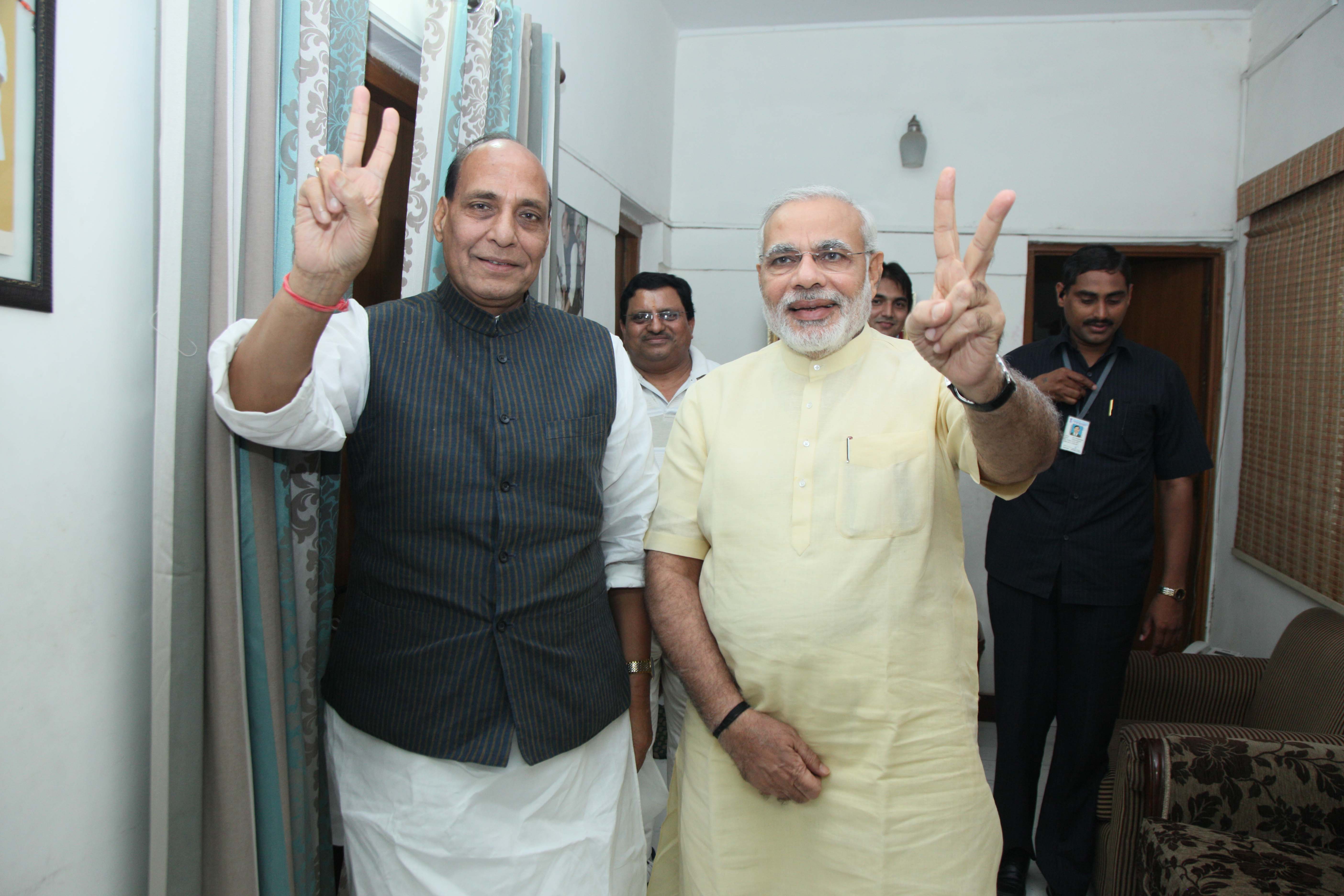 BJP National President Shri Rajanth Singh and Gujarat Chief Minister, Shri Narendra Modi Celebrating after wining Gujarat Bye-Elections at 38 Ashoka Road on June 05, 2013