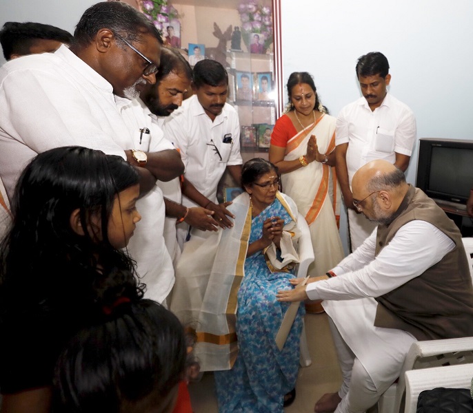 Photographs of BJP National President Shri Amit Shah visited the home of BJP karyakarta Ramith who was killed by communists in Pinarayi village, Kannur (Kerala)