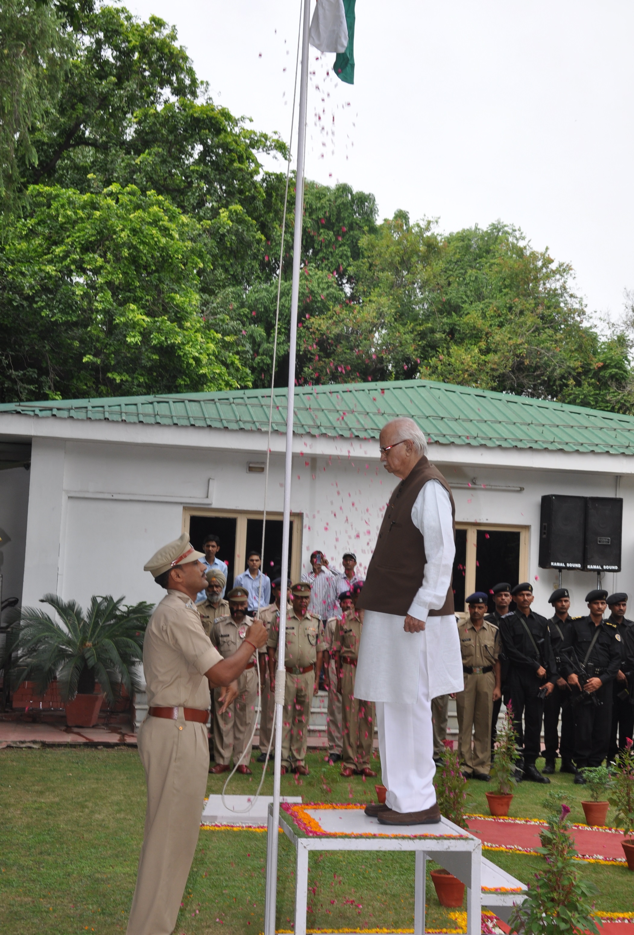 Shri L.K. Advani hoisting the National Flag on Independence Day at his residence 30, Prithviraj Road on August 15, 2014 