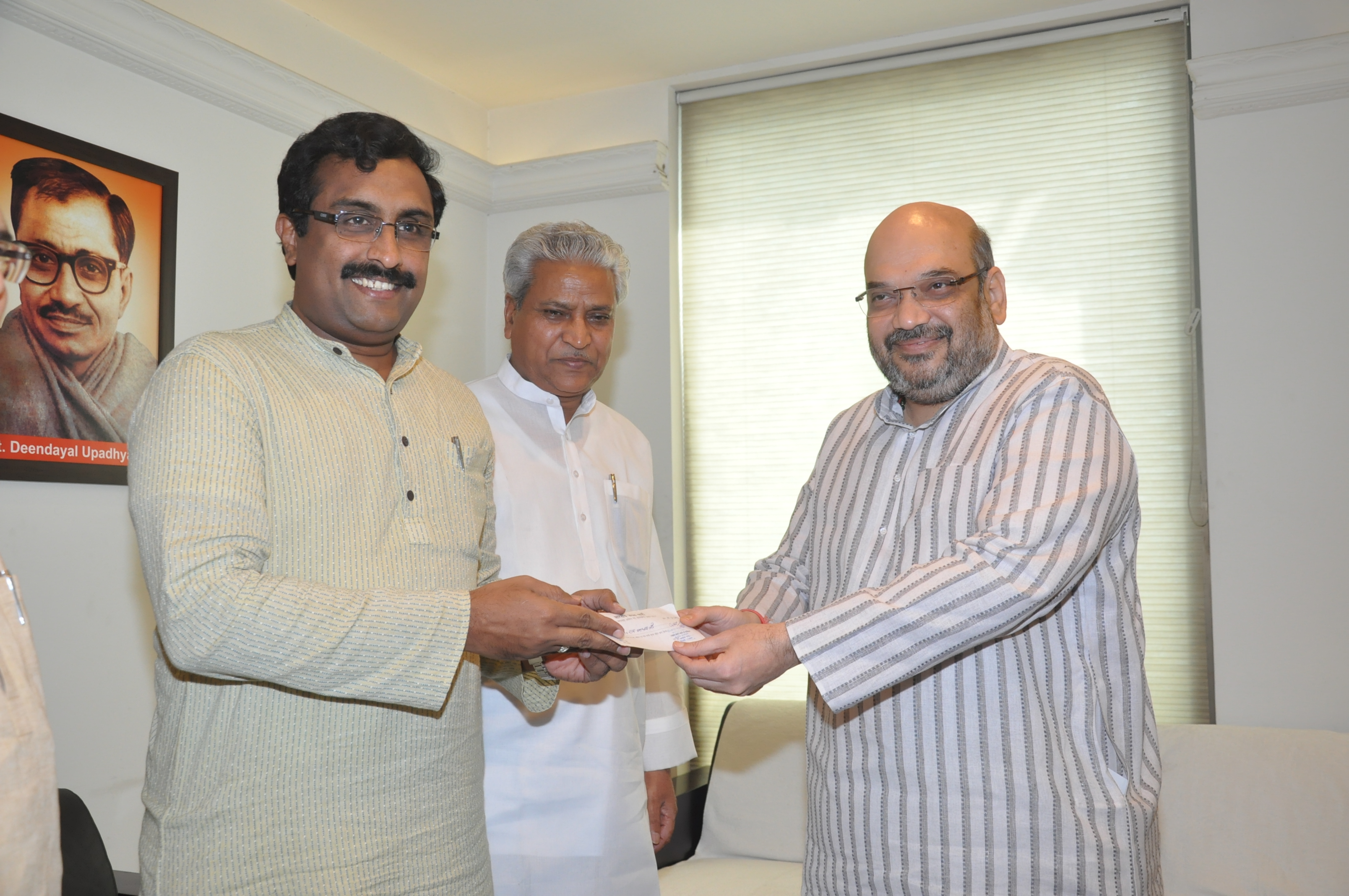 Shri Ram Madhav joining BJP in the presence of BJP President, Shri Amit Shah and General Secretary (Org) Shri Ramlal at 11, Ashoka Road on July 10, 2014