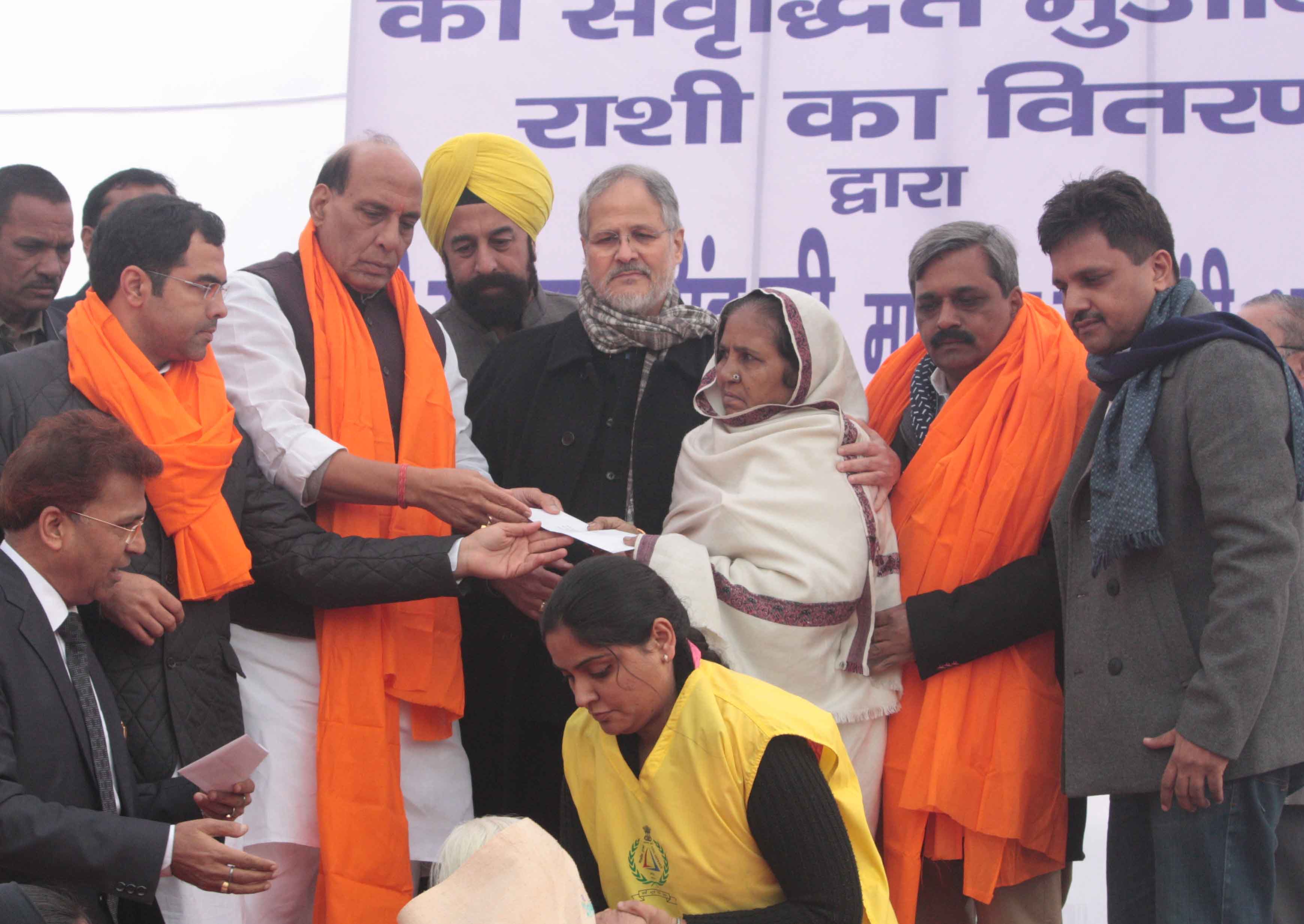 Union Minister for Home Affairs, Shri Rajnath Singh meeting with families of 1984 Anti Sikh Riot victims & giving them extra compensation of Rs 5 Lakhs at B Block, Tilak Vihar Park, Widow colony Dist West Delhi on December 26, 2014